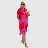 Christiane | Vestido camisa com estampa floral e botão frontal