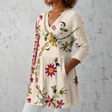 Clara | Blusa longa de linho com padrão floral folclórico e bainha decorada