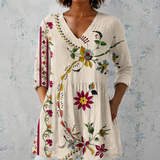 Clara | Blusa longa de linho com padrão floral folclórico e bainha decorada