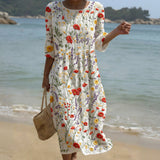 Cristina - Max vestido com decote redondo e padrão de flores